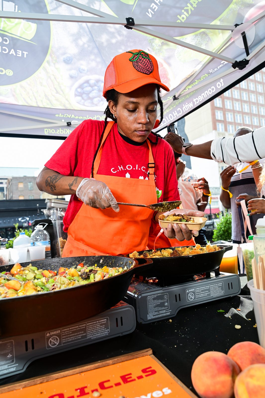 Chef service straight from the live-fire station — PeachFest 2026