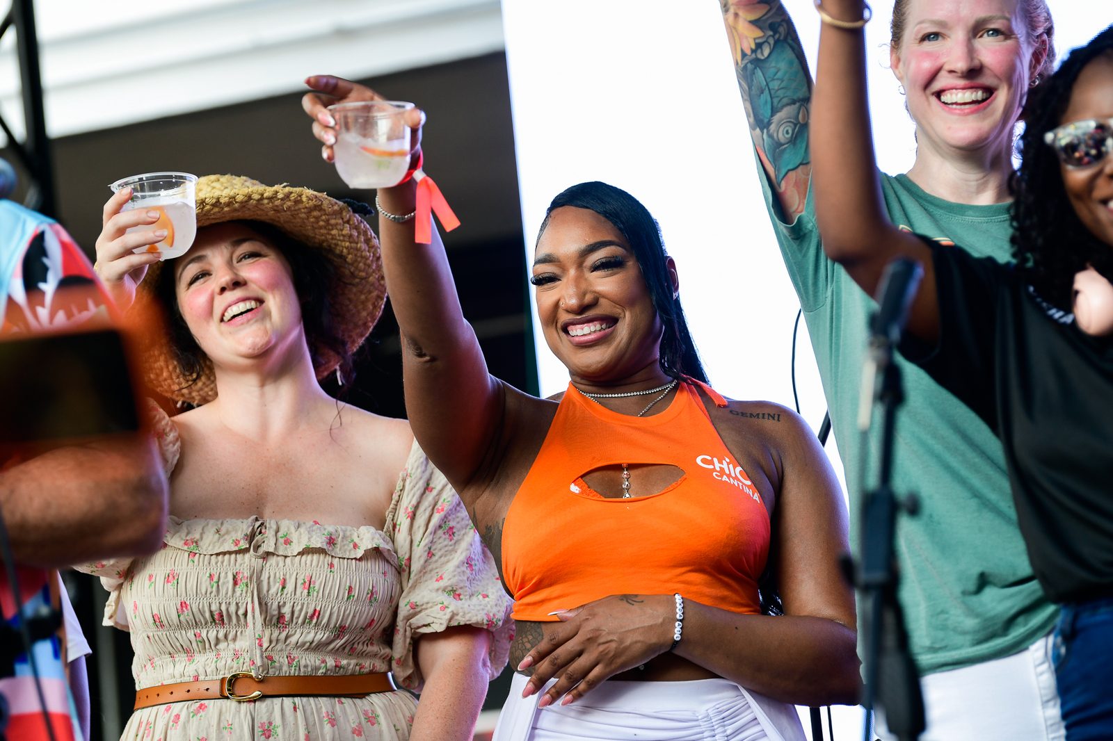 Guests toasting under the summer sun — PeachFest 2026