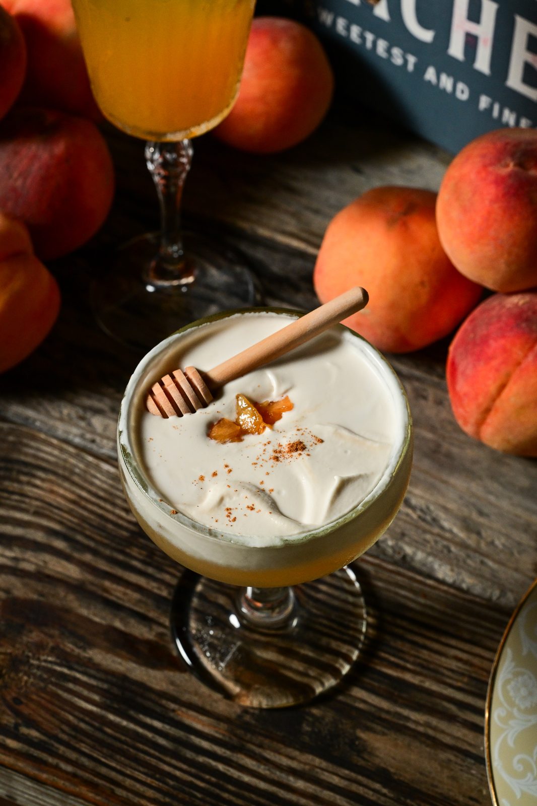 Creamy peach cocktail, honey dipper and cinnamon dust — PeachFest 2026