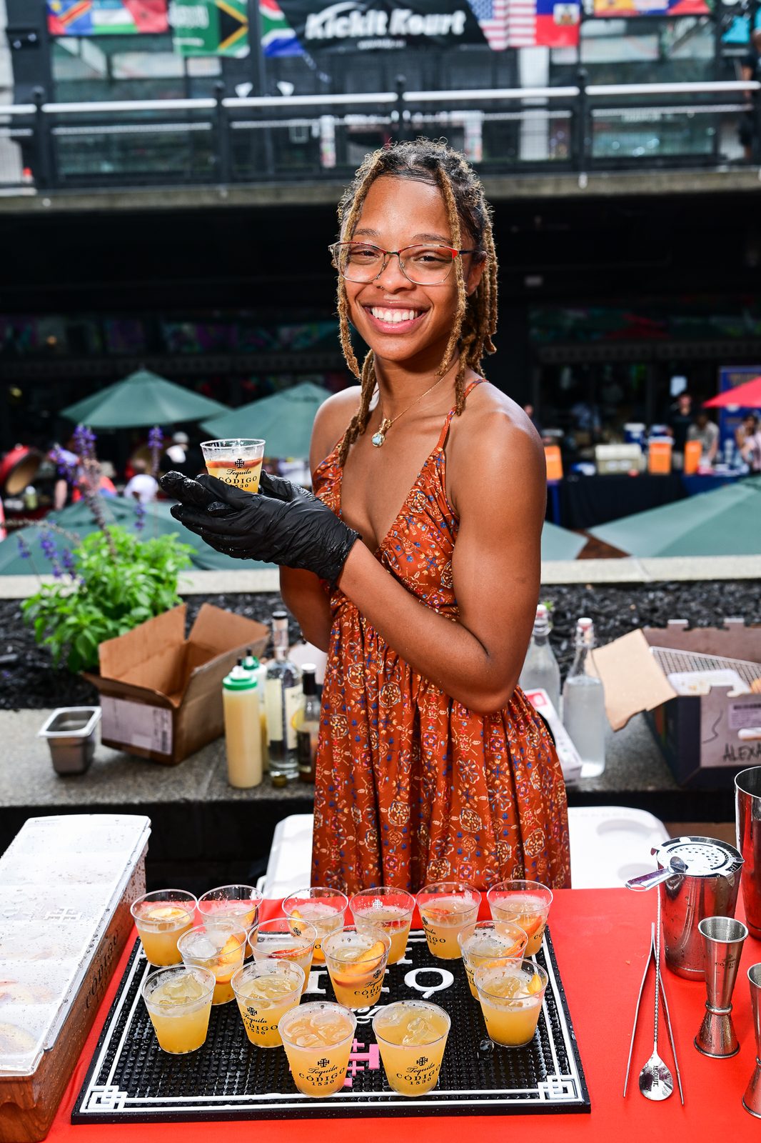 Peach Pit Invitational bartender serving her signature pour — PeachFest 2026