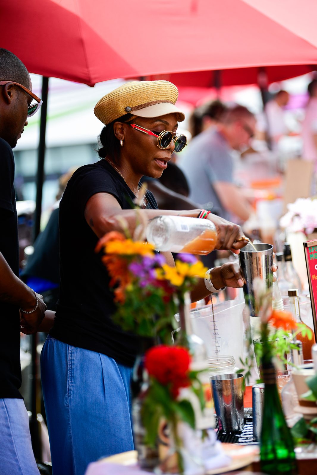 Shaking peach cocktails at the beverage zone — PeachFest 2026