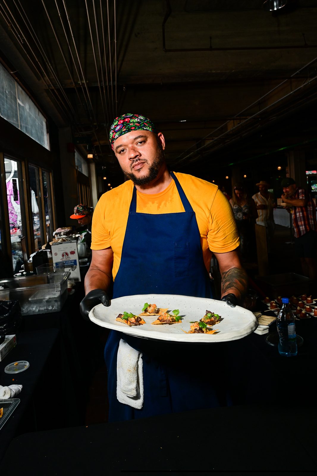 Chef presenting appetizers from the omakase line — PeachFest 2026